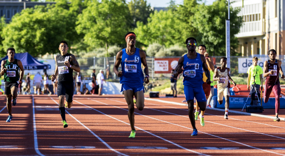 Men running; students