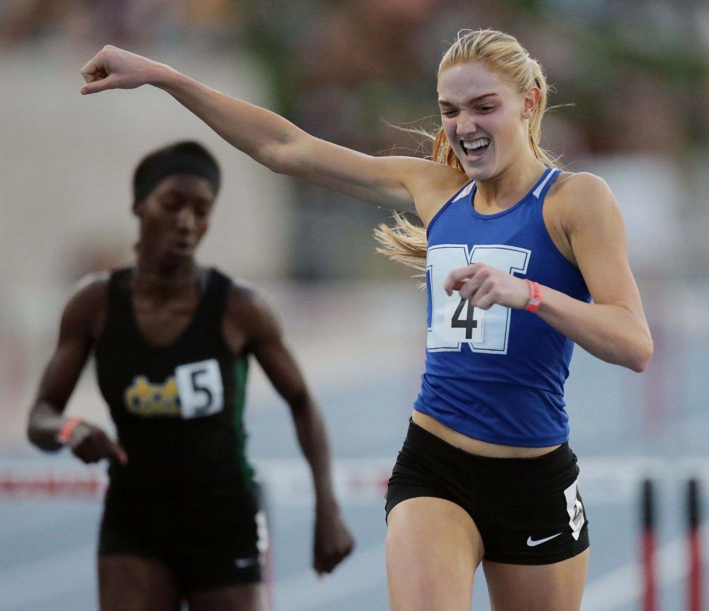 Female athlete racing; Track and Field