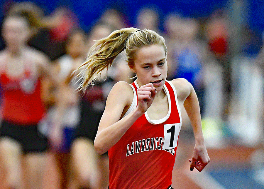 Charlotte Bednar running the 5000m for Lawrenceville High School