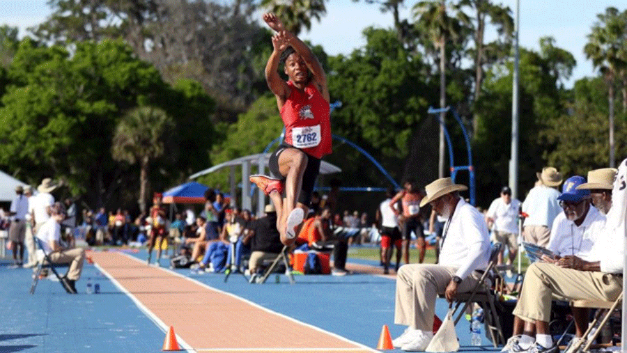 Alyssa Jones mid air during the long jump