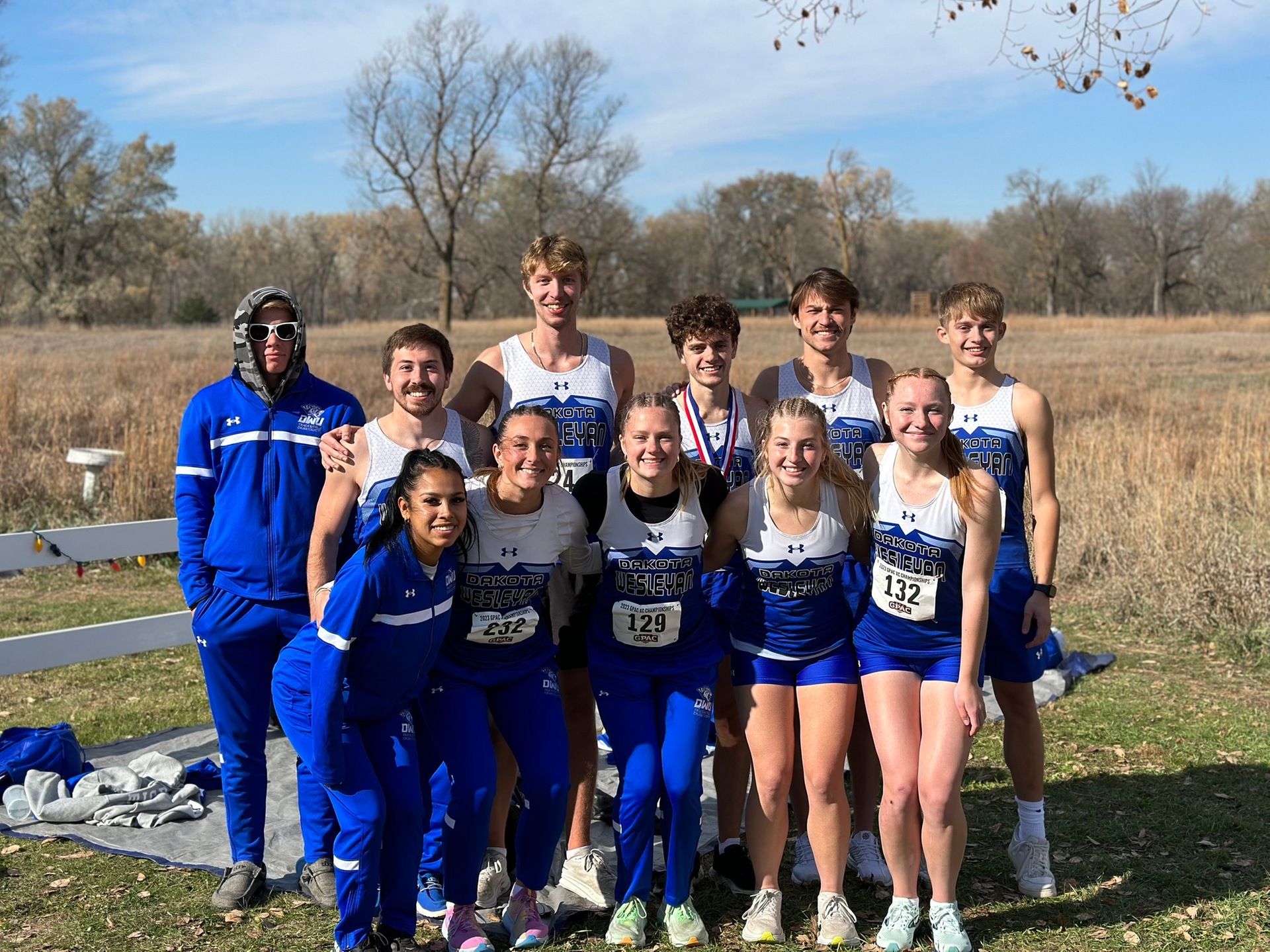 Dakota Wesleyan University Men's and Women's Cross Country team competing at the 2023 GPAC Championships