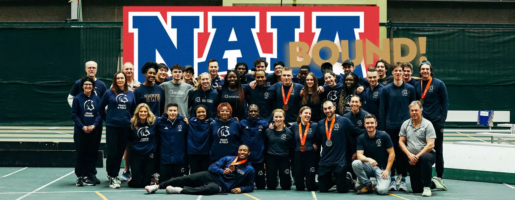 Trinity Western University Cross Country and Track and Field team together after announcing they are moving to the NAIA