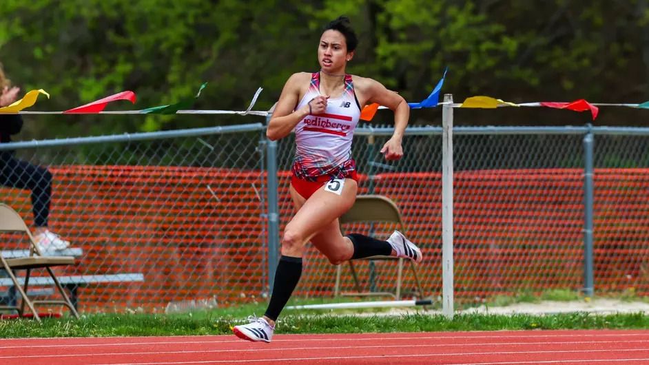 Bernadette Zukina of the Edinboro University Track and Field team breaking the PSAC Championship record in the 400m